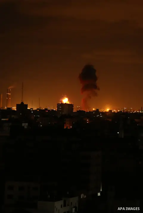 A picture taken on on October 27, 2018 shows a fireball exploding during Israeli air strikes in Gaza City. Photo by Dawoud Abo Alkas