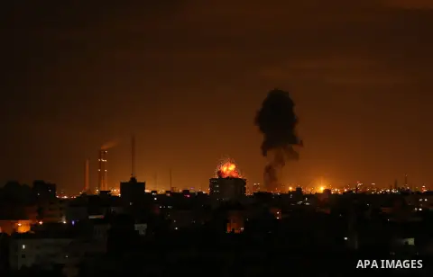 A picture taken on on October 27, 2018 shows a fireball exploding during Israeli air strikes in Gaza City. Photo by Dawoud Abo Alkas