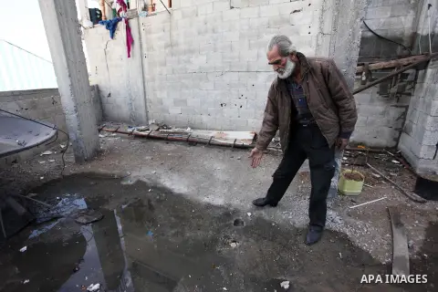 A Palestinian man inspects the damaged of his house following an Israeli air strike on Gaza City on October 27, 2018. A barrage of rockets from Gaza hit Israel overnight, the Israeli army said on October 27, with Israel...