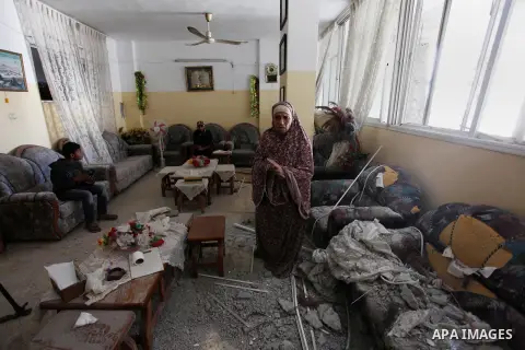 Palestinians inspect the damaged of their house following an Israeli air strike on Gaza City on October 27, 2018. A barrage of rockets from Gaza hit Israel overnight, the Israeli army said on October 27, with Israel reta...