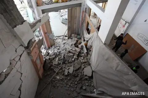 Palestinians inspect the damaged of their house following an Israeli air strike on Gaza City on October 27, 2018. A barrage of rockets from Gaza hit Israel overnight, the Israeli army said on October 27, with Israel reta...
