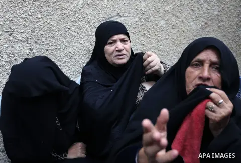 Relatives of Palestinian Ahmed Abu Lebda, 22, who was shot dead by Israeli forces during clashes in tents protest where Palestinians demand the right to return to their homeland at the Israel-Gaza border, mourn during hi...