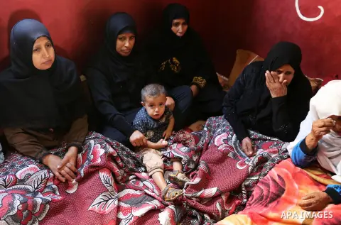 Relatives of Palestinian teenager Khaled Saed, who was killed in an Israeli air strike on the Gaza Strip , mourn during his funeral in Deir el-Balah in central of the Gaza Strip on October 29, 2018. Photo by Ashraf Amra