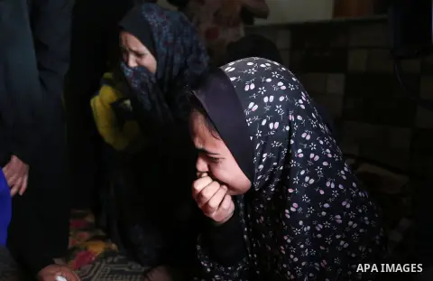 Relatives of Palestinian teenager Khaled Saed, who was killed in an Israeli air strike on the Gaza Strip , mourn during his funeral in Deir el-Balah in central of the Gaza Strip on October 29, 2018. Photo by Ashraf Amra