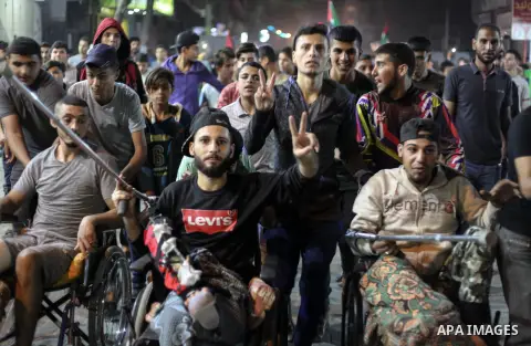 Palestinians take part in a demonstration against the killing of Palestinian teenagers, by an Israeli air strike the day before, in Jabalia in the northern of Gaza Strip on October 29, 2018. Photo by Ramez Habboub
