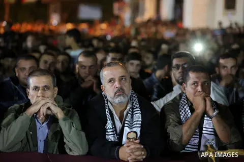 Palestinian supporters of Islamic Jihad movement attends a memorial service for Islamic Jihad militants who were killed in an Israeli operation to blow up a tunnel last year, at the Bureij refugee camp, in central Gaza S...