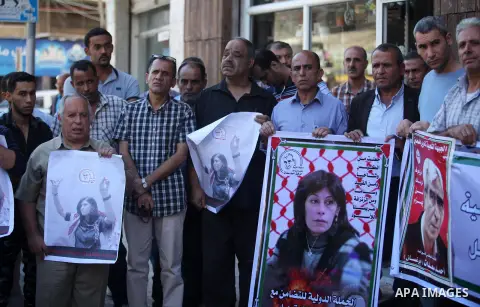 Palestinians take part a protest to show solidarity with the Leftist Legislator Khaleda Jarrar, held in Israeli jails in Gaza city on November 1, 2018. Photo by Mahmoud Ajjour
