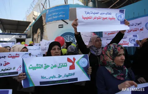 Palestinian employees of United Nations Relief and Works Agency (UNRWA) take part in a protest demanding their rights, outside its headquarter office, in Gaza City, on November 8, 2018. Photo by Mahmoud Ajjour
