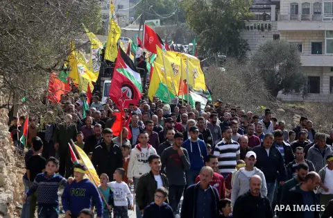 Mourners attend the funeral of Palestinian Mohammed Shreteh who was dead of his wounds that were sustained during clashes with Israeli soldiers last month, in the West Bank village of Mazraa al-Gharbiya, near Ramallah on...