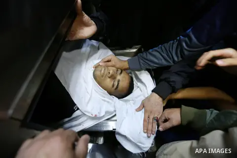 The body of a Palestinian man who was killed during an Israeli airstrike is seen at a morgue, in a hospital in Beit Lahia in the northern of Gaza Strip, on November 12, 2018. Israel's military said it was carrying out ai...