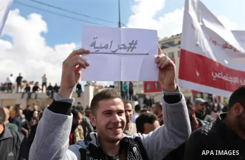 Palestinians take part during a protest against a social security law in the West Bank city of Ramallah on November 12, 2018. Photo by Shadi Hatem