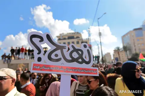 Palestinians take part during a protest against a social security law in the West Bank city of Ramallah on November 12, 2018. Photo by Shadi Hatem