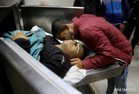 The body of a Palestinian man who was killed during an Israeli airstrike is seen at a morgue, in a hospital in Beit Lahia in the northern of Gaza Strip, on November 12, 2018. Israel's military said it was carrying out ai...