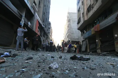Palestinians look at the rubble of a building after an Israeli air strike in Gaza City on November 13, 2018. Renewed violence in Gaza threatened to thwart efforts to end months of unrest as Israeli air strikes killed fou...