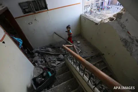 Palestinians look at the rubble of the television station al-Aqsa TV after an Israeli air strike in Gaza City on November 13, 2018, . Renewed violence in Gaza threatened to thwart efforts to end months of unrest as Israe...