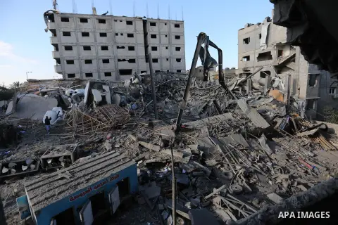 Palestinians look at the rubble of the television station al-Aqsa TV after an Israeli air strike in Gaza City on November 13, 2018, . Renewed violence in Gaza threatened to thwart efforts to end months of unrest as Israe...