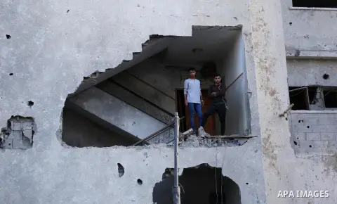 Palestinians look at the rubble of the television station al-Aqsa TV after an Israeli air strike in Gaza City on November 13, 2018, . Renewed violence in Gaza threatened to thwart efforts to end months of unrest as Israe...