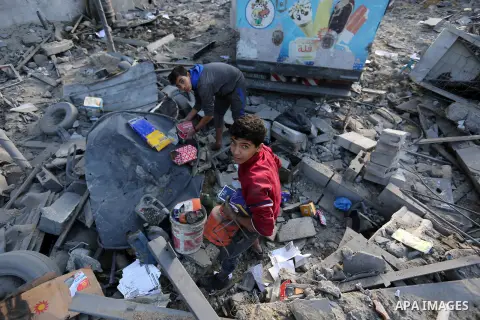 Palestinians look at the rubble of the television station al-Aqsa TV after an Israeli air strike in Gaza City on November 13, 2018, . Renewed violence in Gaza threatened to thwart efforts to end months of unrest as Israe...