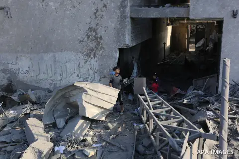 Palestinians look at the rubble of the television station al-Aqsa TV after an Israeli air strike in Gaza City on November 13, 2018, . Renewed violence in Gaza threatened to thwart efforts to end months of unrest as Israe...