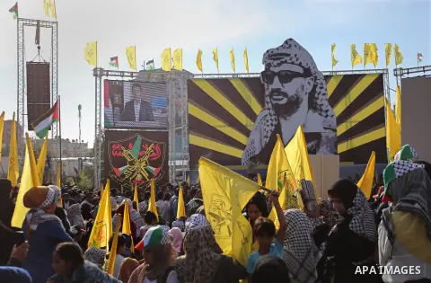 Palestinian Fatah supporters take part in a rally to mark the 14th anniversary of the death of late Palestinian leader Yasser Arafat in Gaza City on November 20, 2018. Photo by Ashraf Amra