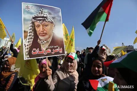 Palestinian Fatah supporters take part in a rally to mark the 14th anniversary of the death of late Palestinian leader Yasser Arafat in Gaza City on November 20, 2018. Photo by Ashraf Amra