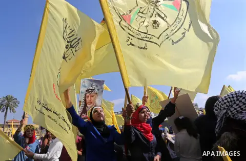 Palestinian Fatah supporters take part in a rally to mark the 14th anniversary of the death of late Palestinian leader Yasser Arafat in Gaza City on November 20, 2018. Photo by Ashraf Amra