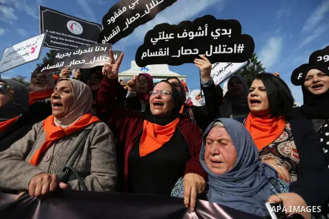 Palestinian women take part during a protest against violence towards women in Gaza city, on November 21, 2018. Photo by Ashraf Amra