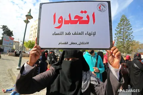 Palestinian women take part during a protest against violence towards women in Gaza city, on November 21, 2018. Photo by Ashraf Amra
