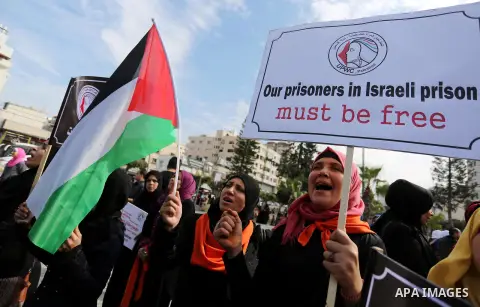 Palestinian women take part during a protest against violence towards women in Gaza city, on November 21, 2018. Photo by Ashraf Amra
