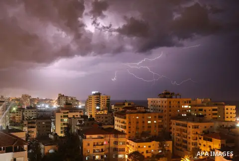 Lightning strikes is seen in the sky over Gaza city during a rainstorm on November 23, 2018. Photo by Abed Abu Ryash ​