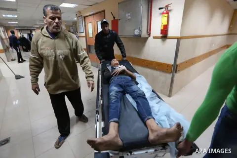 A Palestinian protester who was wounded by Israeli forces during tents protest where Palestinians demand the right to return to their homeland at the Israel-Gaza border, recives treatment at a hospital in Deir al-Balah i...