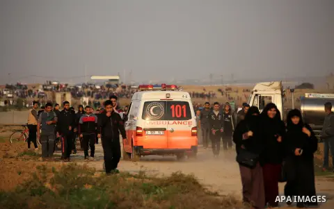 Palestinian protesters gather during clashes with Israeli troops in tents protest where Palestinians demand the right to return to their homeland at the Israel-Gaza border, in east of Gaza City on November 30, 2018. Phot...