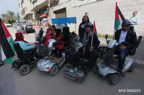 Disabled Palestinians take part in a rally marking the International Day of Persons with Disabilities, in front of Red coss office, in Gaza City, on December 3, 2018. Photo by Mahmoud Ajjour
