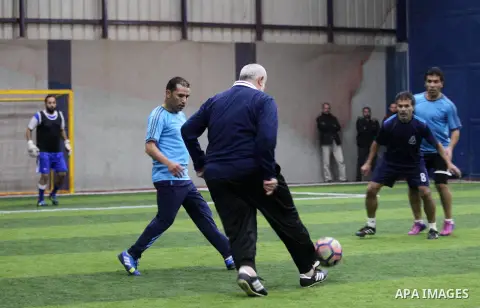 Chairman of the political bureau of the Hamas Palestinian Islamist movement, Ismail Haniyeh plays football during the opening ceremony of playground named "Emad al-Alami" the late Hamas senior leader in Gaza City on Dece...