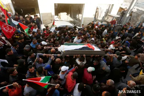 Mourners carry the body of 27-year-old Palestinian man Omar Awad who was shot dead by Israeli forces after he allegedly attempted a car-ramming attack near a checkpoint during his funeral in Hebron in the occupied West B...