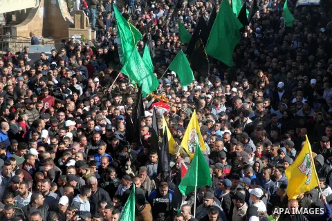 Mourners carry the body of Palestinian Mahmoud Nakhla, 18, who was shot dead by Israeli forces the day before, during his funeral in Jalazone refugee camp, in the West Bank city of Ramallah on December 15, 2018. Photo by...