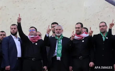 Chairman of the political bureau of the Hamas Palestinian Islamist movement, Ismail Haniyeh waves during a rally marking the 31th anniversary of the founding of the Hamas movement, in Gaza city, December 16, 2018. Photo...
