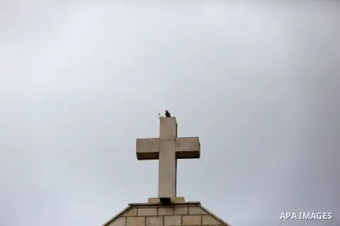 The Cross of the Latin church is seen during the visit of chairman of the political bureau of the Hamas Palestinian Islamist movement, Ismail Haniyeh, in Gaza city on December 29, 2018. Photo by Ashraf Amra