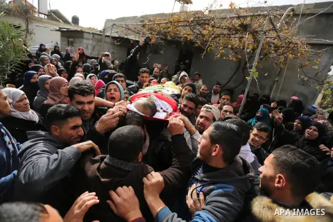 Mourners carry the body of Palestinian, Anwar Qudeih, 33, who was died of his wounds which he sustained by Israeli forces during clashes in tents protest where Palestinians demand the right to return to their homeland at...