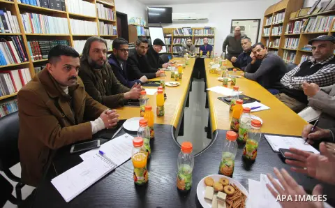 Palestinians attend a workshop on the economic reality in the Gaza Strip between sanctions and taxaion, in Gaza city, on January 2019. Photo by Mahmoud Ajjour