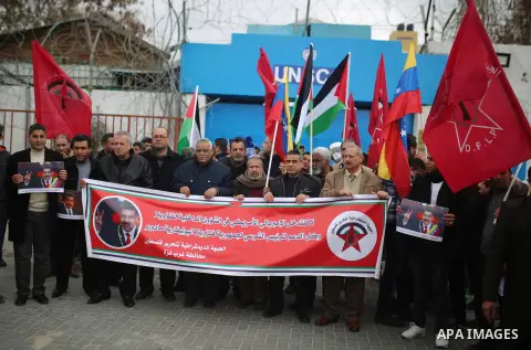 Palestinian Supporters of the Democratic Front for the Liberation of Palestine, take part in a rally in support of the Venezuela's President Nicolas Maduro in front of the headquarter United Nation "UNSCO", in Gaza City,...