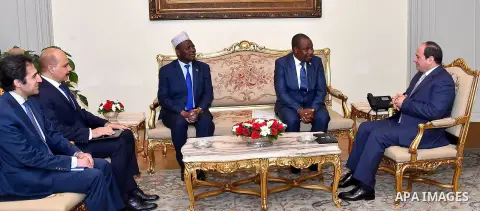 A handout picture released by the Egyptian Presidency on February 4, 2019 shows Egyptian President Abdel Fattah al-Sisi (R) meeting with Minister of Foreign Affairs of Burundi, Ezechiel Nibigira, at the presidential pala...