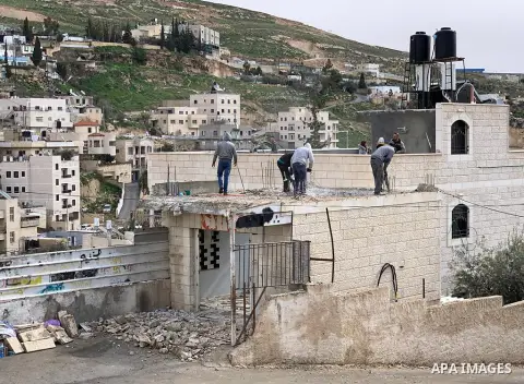 Palestinian Ahmed Obeidat demolish a part of his house, in Jabal al-Mukaber, in Jerusalem, February 9, 2019. Obeidat was forced to either arrange for the demolition of his home himself, or pay for the demolition by the o...