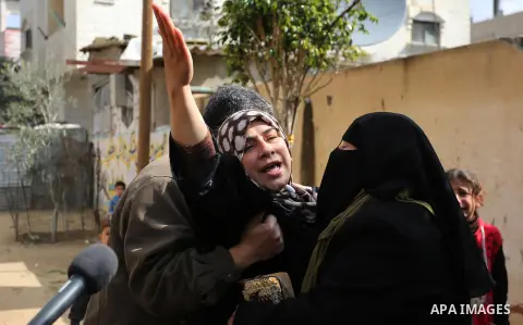 Mourners carry the body of Palestinian Policeman Major Abdul Hamid al-Ekar, who suffocated to death while in a cross-border tunnel under Gaza's frontier with Egypt, during his funeral in Rafah in the southern Gaza Strip,...