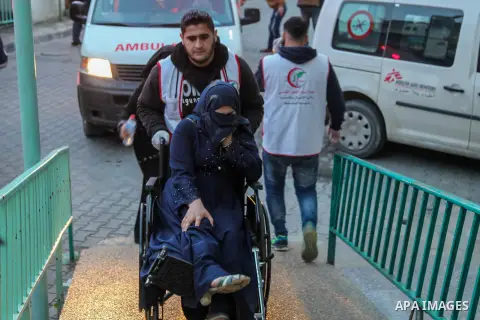 A wounded Palestinian woman, who was injured by Israeli security force during a protest near the Israeli settlement of Kibbutz Zikim, is wheeled at a hospital in Jabalia in the northern Gaza strip on February 12, 2019. P...