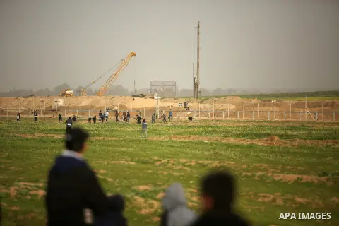 Palestinian protesters clash with Israeli troops following the tents protest where Palestinians demand the right to return to their homeland at the Israel-Gaza border, in the east of Gaza city, February 15, 2019. At leas...