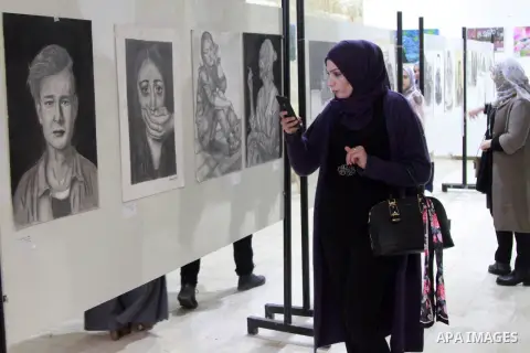 Palestinians attend "warm steps exhibition", organised by directorate of education in Ramallah and Al-Bireh Governorate, in the West Bank city of Ramallah, February 18, 2019. Photo by Ahmad Arouri