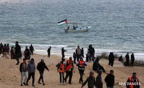 Palestinian demonstrators protest on the beach along the northern Gaza border, across from the Israeli settlement of Kibbutz Zikim, on February 19, 2019, as part of weekly maritime protests against the naval blockade of...