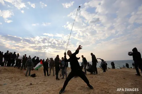 Palestinian demonstrators protest on the beach along the northern Gaza border, across from the Israeli settlement of Kibbutz Zikim, on February 19, 2019, as part of weekly maritime protests against the naval blockade of...