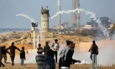Palestinian demonstrators protest on the beach along the northern Gaza border, across from the Israeli settlement of Kibbutz Zikim, on February 19, 2019, as part of weekly maritime protests against the naval blockade of...